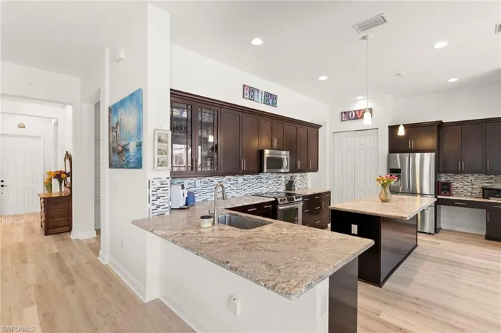 Large Kitchen open and bright for entertaining with built-in desk