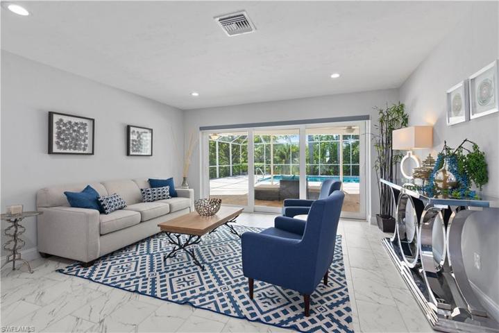 Living room overlooks the lake and pool