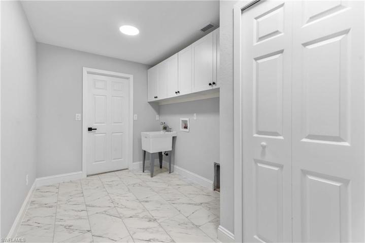 Huge laundry with tub & pantry