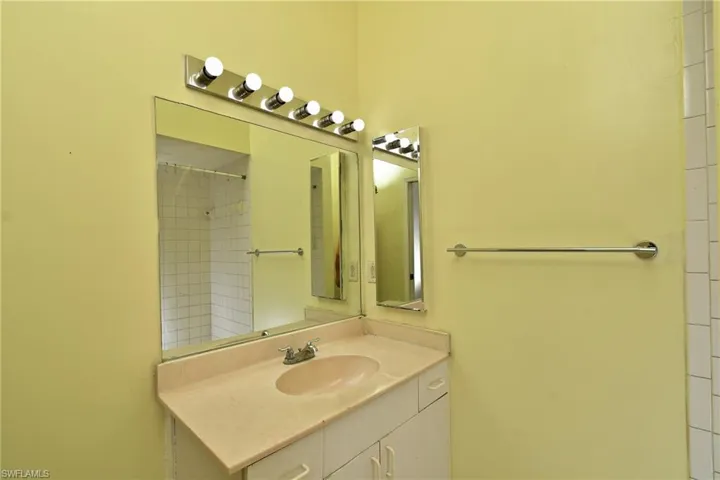 Full bathroom featuring vanity and a shower
