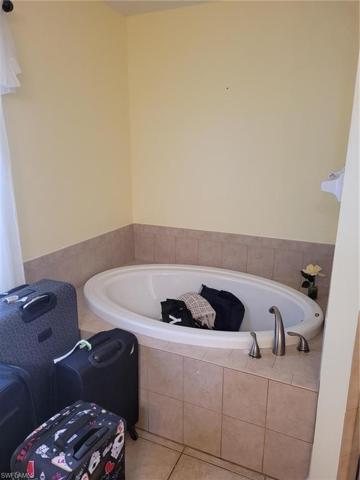 Master Bath offers a separate Jacuzzi brand soaking tub and shower