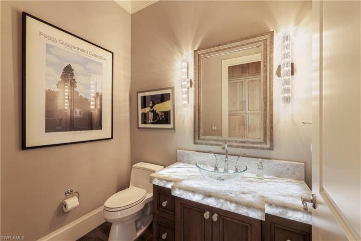 Powder room just off the den/office.  The countertop/sink area is lit from underneath. Your guests will be impressed!