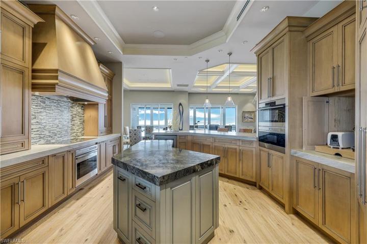 Stunning cabinetry, stainless appliances, kitchen island and custom countertops. This is a chef's dream!