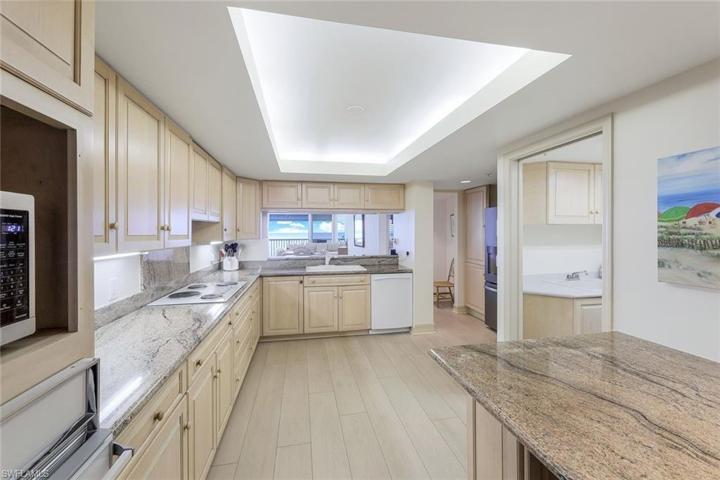 Kitchen ~ granite countertops. Laundry Room to the Right.