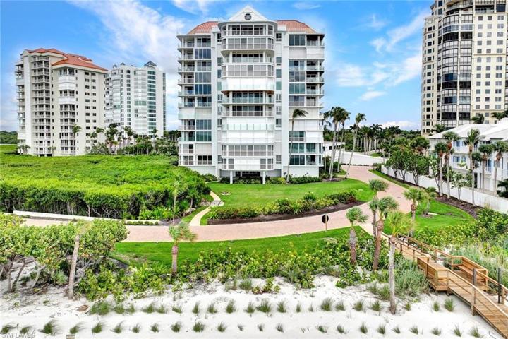 Beach House View from the Beach.  Penthouse 2 is top middle with large Picture Window.  PRIVATE ROOFTOP BALCONY.