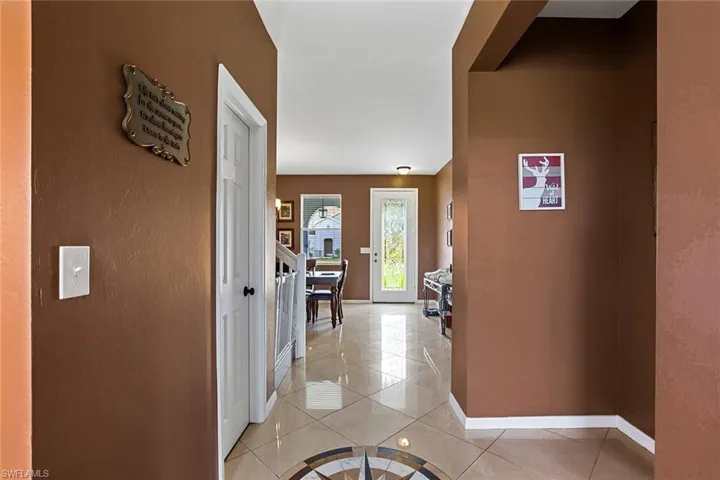 View of front door and dining room