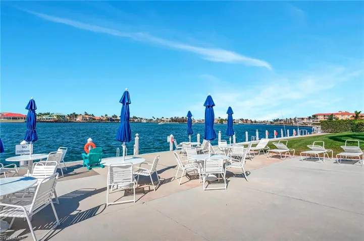 View of patio with a water view