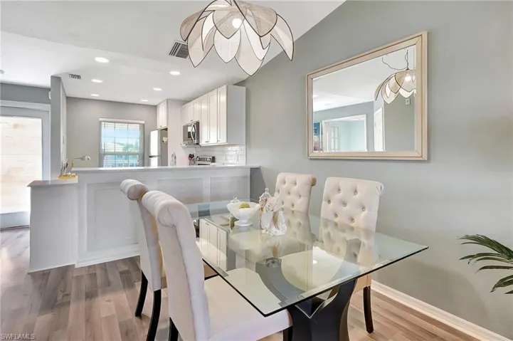 Dining space featuring hardwood / wood-style flooring