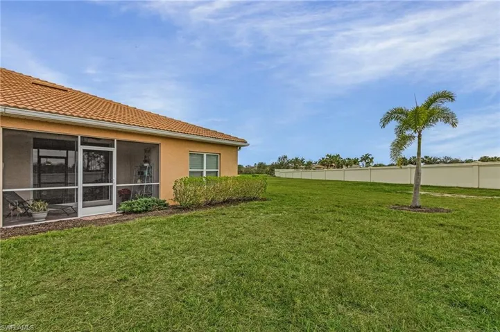 View of yard featuring a sunroom