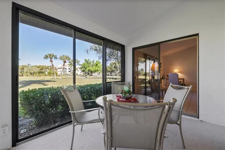 Sunroom featuring lofted ceiling
