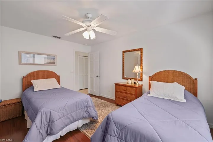 Bedroom featuring wood finished floors and a ceiling fan