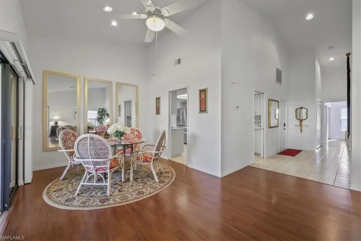 Dining space featuring recessed lighting, lofted ceiling, light wood finished floors, and a ceiling fan
