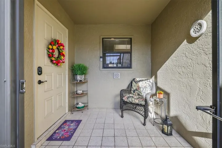 Property entrance with stucco siding