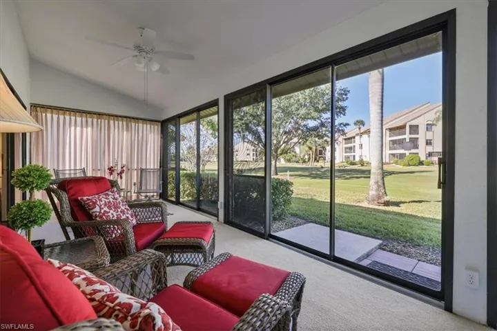 Sunroom with a ceiling fan, lofted ceiling, and an outdoor hangout area