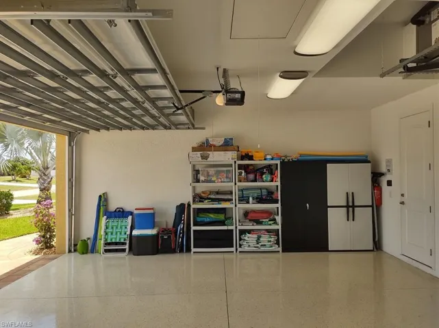 Garage featuring a garage door opener