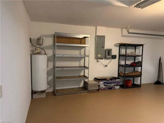 Basement with electric water heater and electric panel