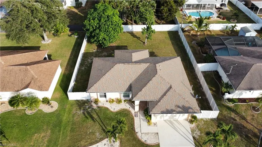 View of subject property featuring a pool area