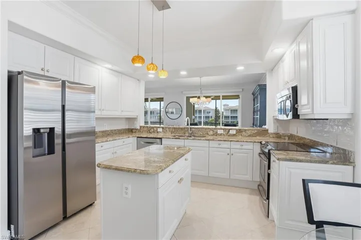 Bright, spacious kitchen with ample storage and counter space.