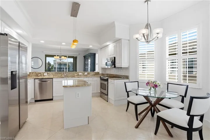 Well-appointed and refreshed kitchen with generous storage and an inviting eat-in space