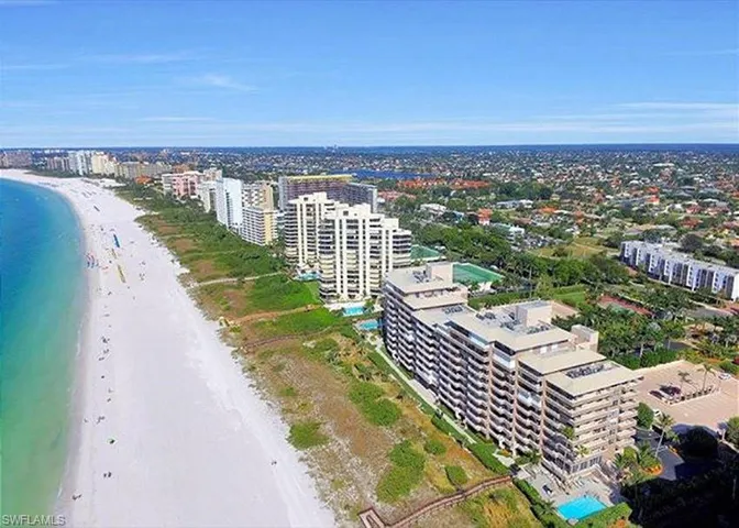 Drone / aerial view featuring a water view and a beach view