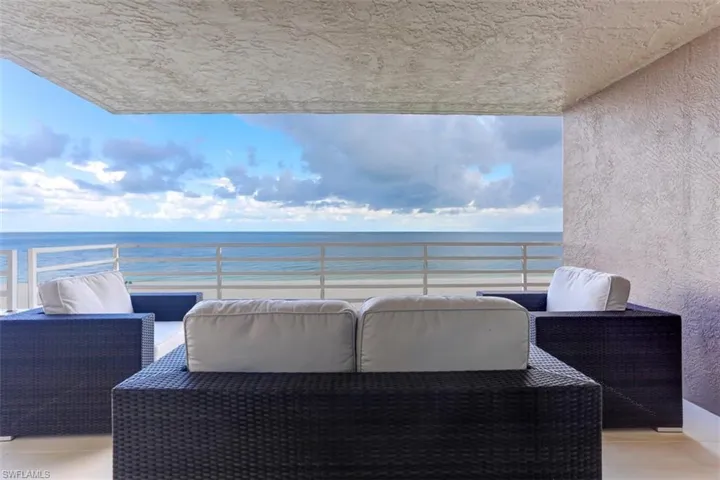 Balcony featuring a wate a view of the beach
