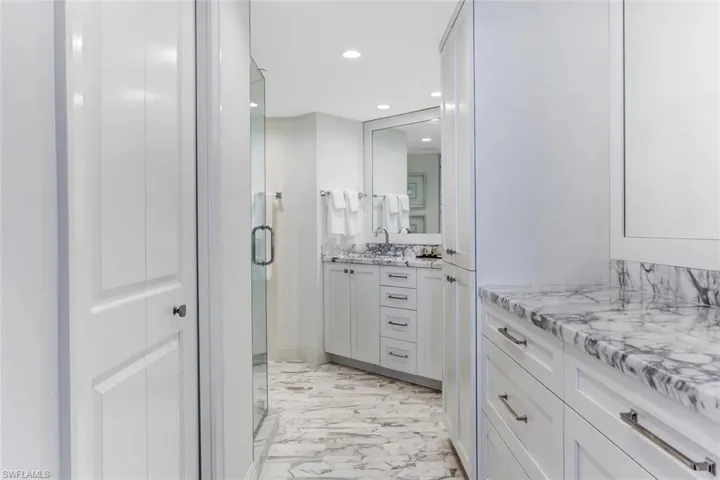 Bathroom with vanity and an enclosed shower