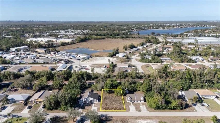 Aerial perspective of suburban area with property parcel outlined