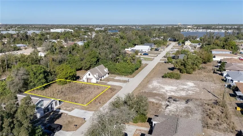 Aerial view of residential area featuring property boundaries highlighted