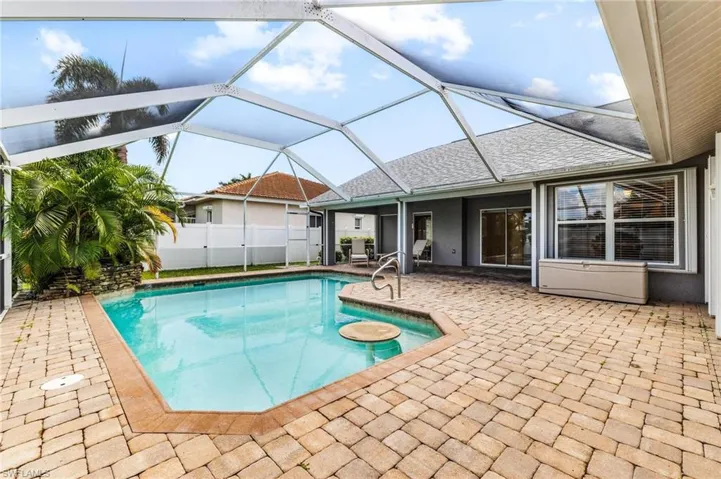 View of pool featuring a fenced in pool, a lanai, fence, and a patio