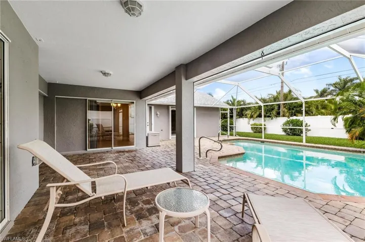 View of pool featuring a fenced in pool, a lanai, a patio, and fence private yard