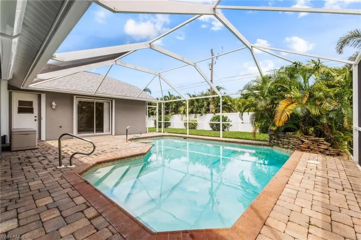 View of pool with fence, a lanai, a patio, and a fenced in pool