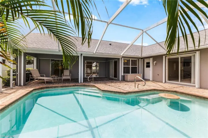 Pool featuring a lanai and a patio area