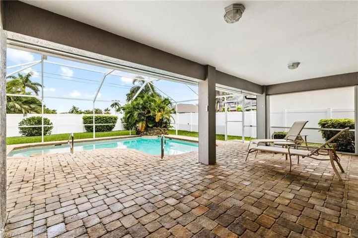 View of swimming pool featuring a fenced backyard, a fenced in pool, a lanai, and a patio area