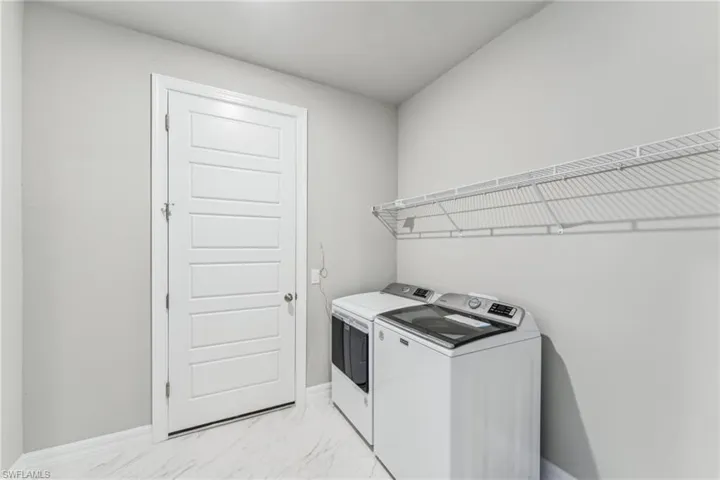 Laundry area featuring separate washer and dryer