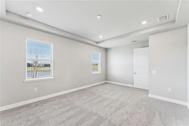 Unfurnished room featuring carpet flooring