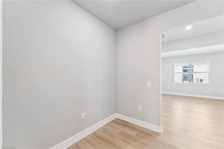 Empty room with light wood-type flooring
