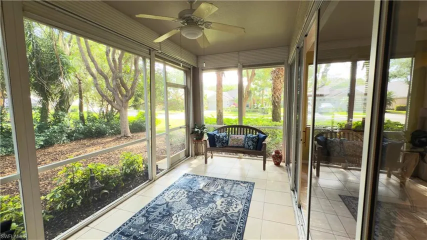 Lanai/solarium with a ceiling fan