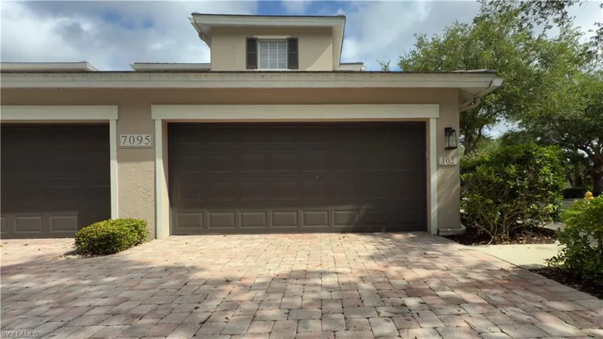 Two car garage featuring extra storage.