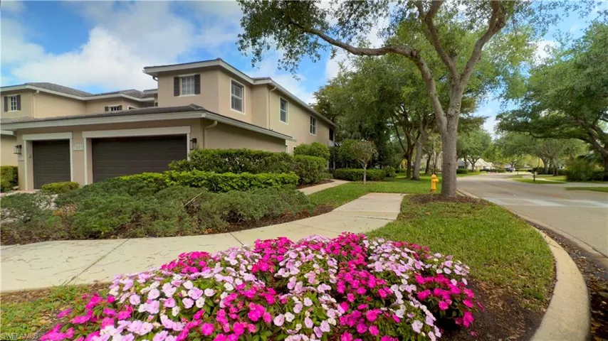 Beautiful end-unit coach home. Feels like a single family home with open side yard.