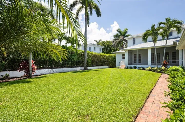 View of yard featuring a sunroom