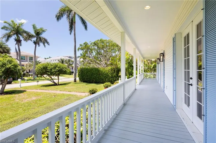 Wooden porch with a lawn