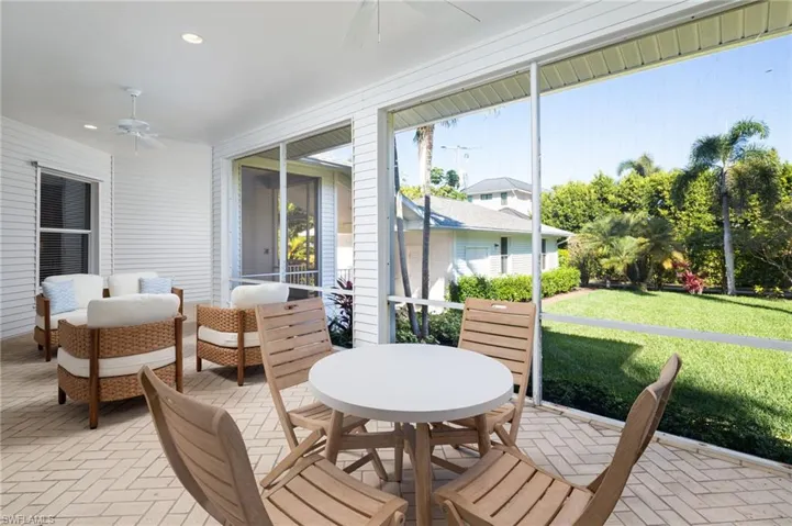 Sunroom / solarium with a ceiling fan