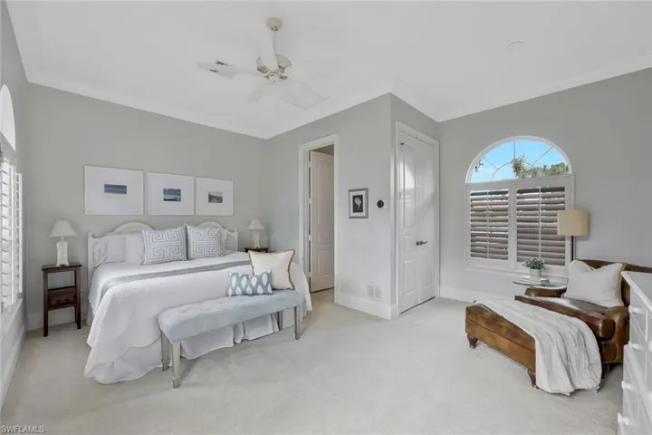 Casita bedroom featuring crown molding, a closet, and a ceiling fan