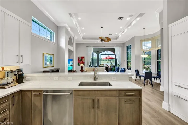 Open to Living room with water and golf course views. Easy access to outdoor entertainment
