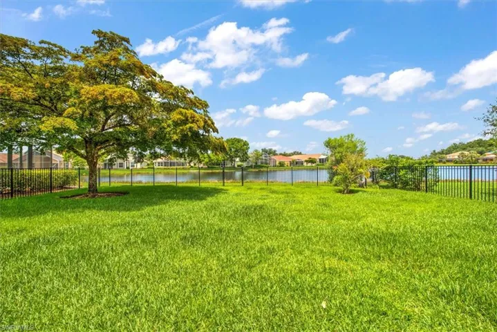 View of yard with a water view