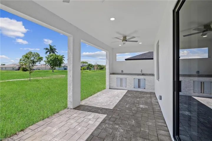 View of patio with sink and ceiling fan