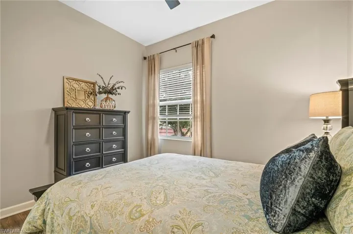 Bedroom featuring wood finished floors and ceiling fan
