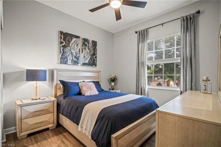 Bedroom featuring wood finished floors and a ceiling fan