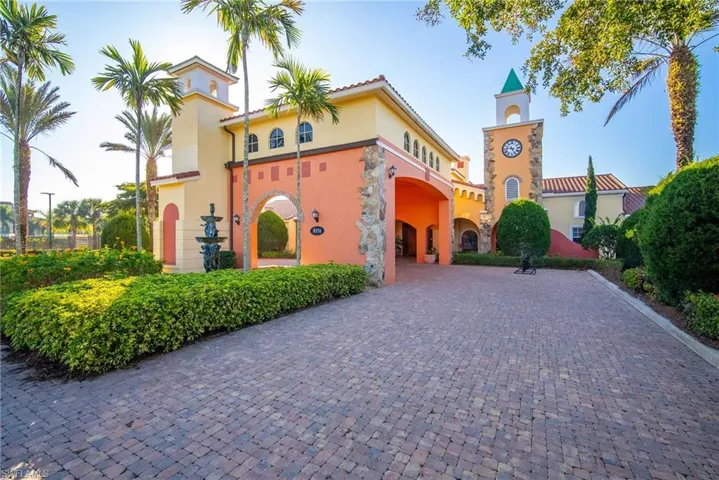 Mediterranean / spanish-style house with stucco siding and curved driveway