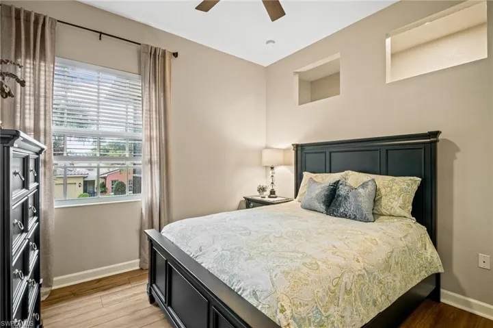 Bedroom with light wood-style flooring and ceiling fan